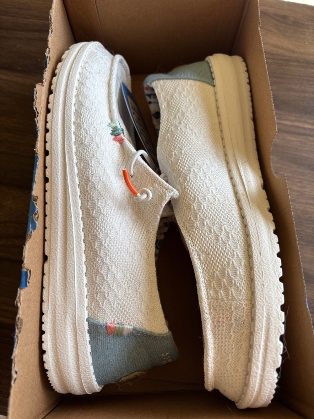 Hey Dude Slip-On Sneakers in Cream with Blue and Coral Accents